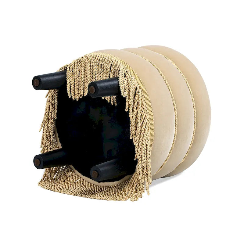 Pouf rond tapissé avec franges en fil doré